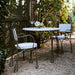 The Harpen Metal Outdoor Dining Arm Chair by Jake Arnold